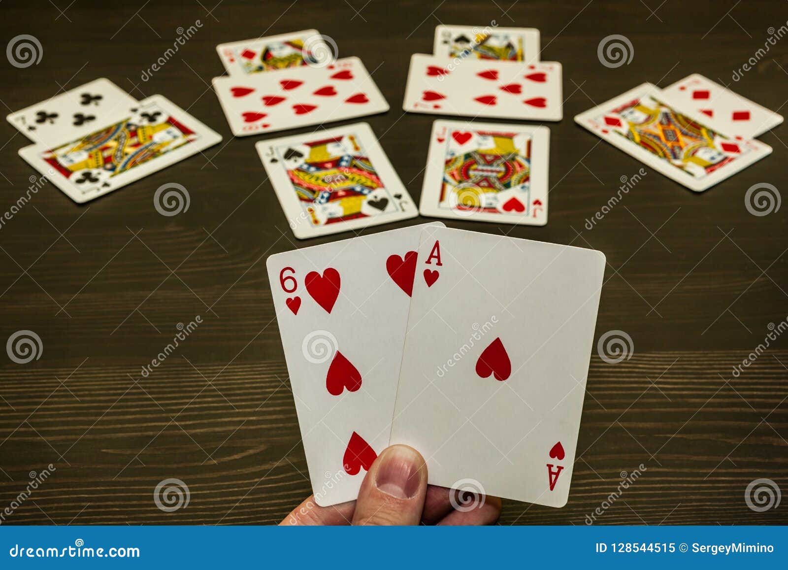 a game of cards. two trumps in the hand. a winning game.